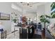 Elegant bar area with modern design and comfortable seating adjacent to living spaces at 841 Oaks Shores Rd, Leesburg, FL 34748
