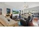 Spacious living room with stylish decor, modern furniture, and bright, neutral colors at 841 Oaks Shores Rd, Leesburg, FL 34748