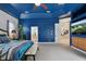 A beautifully decorated primary bedroom with a blue accent wall and en suite bathroom at 841 Oaks Shores Rd, Leesburg, FL 34748