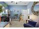 Bright office with computer setup, glass desk, and blue walls, offering a serene workspace at 841 Oaks Shores Rd, Leesburg, FL 34748