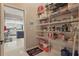 This pantry includes wire shelving and a view into the adjoining kitchen at 841 Oaks Shores Rd, Leesburg, FL 34748