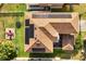 Bird's eye view of the home's roof, yard, and patio set at 9020 Breezy Meadow Way, Orlando, FL 32829
