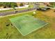 Outdoor community basketball court on a sunny day surrounded by green grass at 9020 Breezy Meadow Way, Orlando, FL 32829