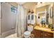 Bathroom featuring a shower/tub combo, marble vanity, and decorative accents at 9020 Breezy Meadow Way, Orlando, FL 32829