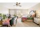 Bright bedroom featuring a comfy king bed, work area, and carpeted floors at 9020 Breezy Meadow Way, Orlando, FL 32829