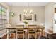 Elegant dining room featuring a large wooden table and a chandelier at 9020 Breezy Meadow Way, Orlando, FL 32829