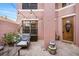 Charming entryway with a wreath and outdoor seating with string lights at 9020 Breezy Meadow Way, Orlando, FL 32829