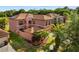 Aerial shot of a two-story home featuring manicured lawns and mature landscaping at 9020 Breezy Meadow Way, Orlando, FL 32829