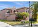 Charming two-story home with well-manicured lawn and lush tropical landscaping at 9020 Breezy Meadow Way, Orlando, FL 32829