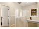 Bright upper hallway offering multiple doorways, a storage nook, and neutral decor at 9020 Breezy Meadow Way, Orlando, FL 32829