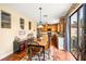 Cozy dining area in kitchen featuring a table, wooden cabinets, and large sliding door at 9020 Breezy Meadow Way, Orlando, FL 32829