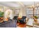 Open-concept living room and dining area with hardwood floors and lots of natural light at 9020 Breezy Meadow Way, Orlando, FL 32829