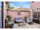 Charming backyard patio with string lights, plants, and seating area at 9020 Breezy Meadow Way, Orlando, FL 32829