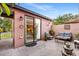 Inviting outdoor patio with comfortable seating and string lights, accessible through sliding glass doors at 9020 Breezy Meadow Way, Orlando, FL 32829