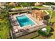 Community pool with lounge chairs and a covered area for residents' enjoyment at 9020 Breezy Meadow Way, Orlando, FL 32829