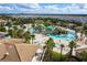Aerial view of the resort-style pool, lazy river, community amenities, and lush landscaping at 9332 Sommerset Hills Dr, Davenport, FL 33896