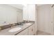 Bright bathroom featuring a double sink vanity with modern fixtures and plenty of counter space at 9332 Sommerset Hills Dr, Davenport, FL 33896