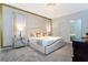 Bright bedroom with a unique accent wall, stylish furniture, and plush bedding at 9332 Sommerset Hills Dr, Davenport, FL 33896