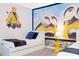 Themed bedroom with twin beds, playful decor, and vibrant accent lighting at 9332 Sommerset Hills Dr, Davenport, FL 33896