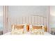 Close-up of a plush bed with decorative pillows and a detailed headboard design at 9332 Sommerset Hills Dr, Davenport, FL 33896