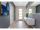 Stylish entryway with modern console table, statement mirror and elegant decor at 9332 Sommerset Hills Dr, Davenport, FL 33896