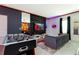 Bright game room with foosball table, modern seating, and themed Incredibles decorations at 9332 Sommerset Hills Dr, Davenport, FL 33896