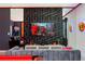 Cozy game room with textured wall, modern seating, and TV featuring Incredibles imagery at 9332 Sommerset Hills Dr, Davenport, FL 33896