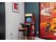 Fun-filled game room with a classic NBA Jam arcade game and vibrant Incredibles artwork at 9332 Sommerset Hills Dr, Davenport, FL 33896