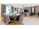 Open-concept dining and living space with stylish decor and ample natural light at 9332 Sommerset Hills Dr, Davenport, FL 33896