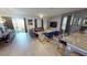 Expansive open-concept living area connecting dining, living, and outdoor spaces at 9332 Sommerset Hills Dr, Davenport, FL 33896