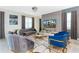 Elegant living room with stylish furniture, large TV, and decorative accents at 9332 Sommerset Hills Dr, Davenport, FL 33896