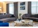 Sophisticated living room with plush seating, marble coffee tables, and elegant decor at 9332 Sommerset Hills Dr, Davenport, FL 33896