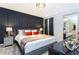 Luxurious main bedroom suite with elegant decor, a large bed, and stylish furnishings at 9332 Sommerset Hills Dr, Davenport, FL 33896