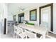 Covered patio featuring a dining area and seating area, perfect for outdoor entertaining at 9332 Sommerset Hills Dr, Davenport, FL 33896