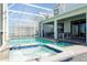 Sparkling pool and hot tub under a screened enclosure, perfect for relaxation and recreation at 9332 Sommerset Hills Dr, Davenport, FL 33896