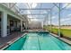 Inviting pool and hot tub within a screened enclosure, complete with lounge chairs and seating at 9332 Sommerset Hills Dr, Davenport, FL 33896