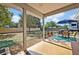 Back patio with dining set overlooks large backyard with ample space to enjoy at 975 N Elder Rd, Sanford, FL 32771
