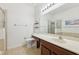 Bathroom featuring a toilet, sink and mirror, and a glass shower stall at 10404 Park Commons Dr, Orlando, FL 32832