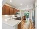 Modern kitchen with stainless steel appliances, plenty of cabinetry, and an open concept at 10404 Park Commons Dr, Orlando, FL 32832