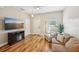 Cozy living room with hardwood floors, fireplace, and a comfortable seating arrangement at 10404 Park Commons Dr, Orlando, FL 32832