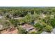 An aerial view outlines the property surrounded by large trees in the neighborhood at 1051 Arden St, Longwood, FL 32750