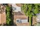 Aerial view of the home showing the cracked driveway and the enclosed patio at 1051 Arden St, Longwood, FL 32750