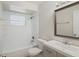 Bright bathroom features a shower over the tub and a modern vanity at 1051 Arden St, Longwood, FL 32750
