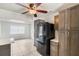 Spacious kitchen showcasing modern black appliances and wooden cabinets at 1051 Arden St, Longwood, FL 32750