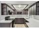 Modern kitchen with stainless steel appliances, dark cabinetry, and quartz countertops at 1051 Arden St, Longwood, FL 32750