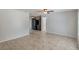 Bright living room featuring neutral walls, tile flooring, and a ceiling fan at 1051 Arden St, Longwood, FL 32750