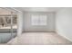Bright living room features neutral paint, tile flooring, and a sliding glass door at 1051 Arden St, Longwood, FL 32750
