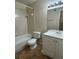 Bathroom with white tiled tub and shower combo, toilet, vanity with sink, and earth tone flooring at 1081 S Hiawassee Rd # 726, Orlando, FL 32835