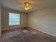 Bedroom featuring a ceiling fan, neutral walls, carpet and a window at 1081 S Hiawassee Rd # 726, Orlando, FL 32835