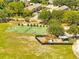 Aerial view shows community basketball courts surrounded by well-maintained landscaping at 1121 Arbor Glen Cir, Winter Springs, FL 32708